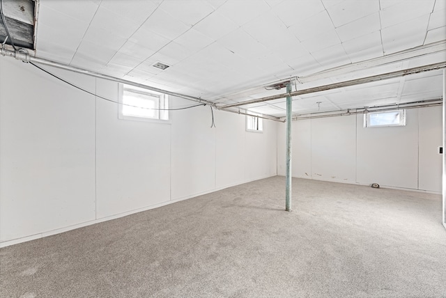 basement with carpet and plenty of natural light