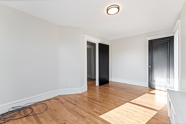 spare room featuring light wood-type flooring