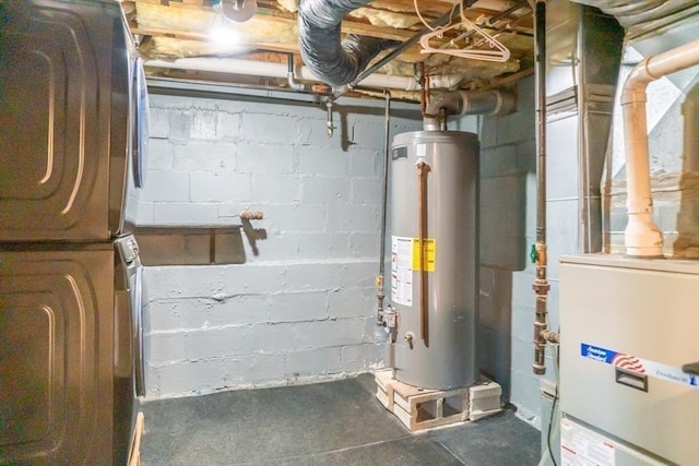 utility room featuring heating unit and gas water heater