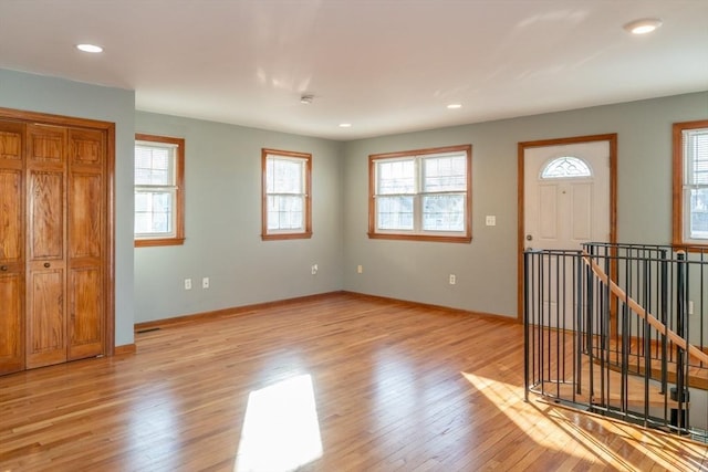 foyer entrance featuring a healthy amount of sunlight and light hardwood / wood-style flooring