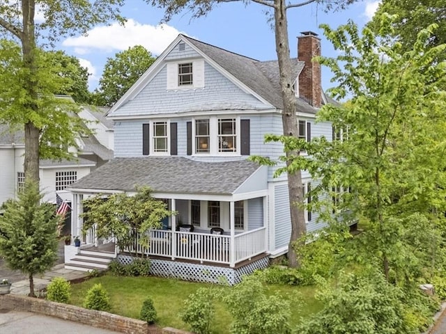 14 Thoreau St, Concord, MA 01742 - view of front of house with a chimney, a shingled roof, and a porch