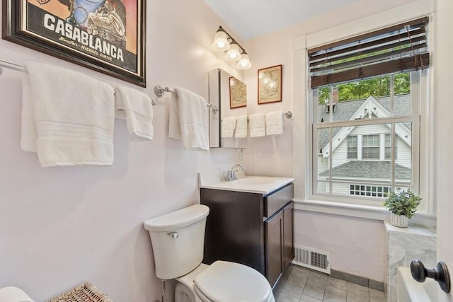 14 Thoreau St, Concord, MA 01742 - full bathroom featuring vanity, toilet, a tub to relax in, tile patterned floors, and baseboards