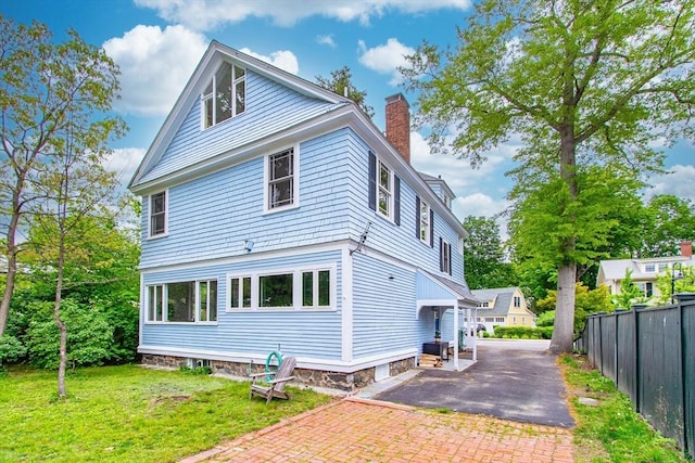 14 Thoreau St, Concord, MA 01742 - back of property with a chimney and driveway