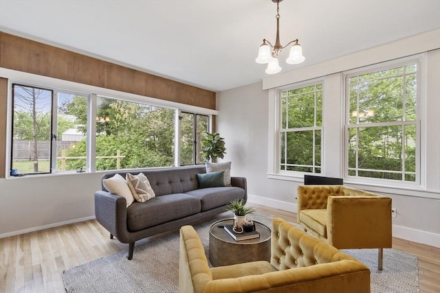 14 Thoreau St, Concord, MA 01742 - living room with baseboards, a chandelier, and wood finished floors
