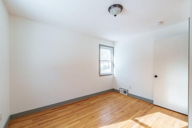 empty room with light wood-type flooring