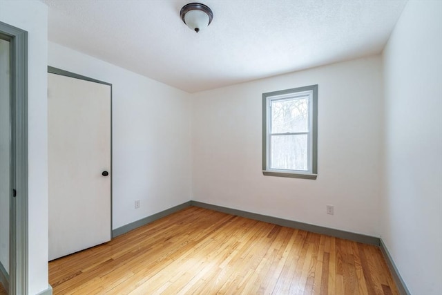 unfurnished room featuring light hardwood / wood-style floors