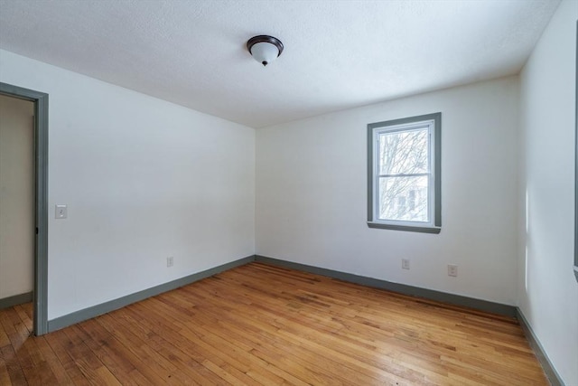 unfurnished room featuring light hardwood / wood-style flooring