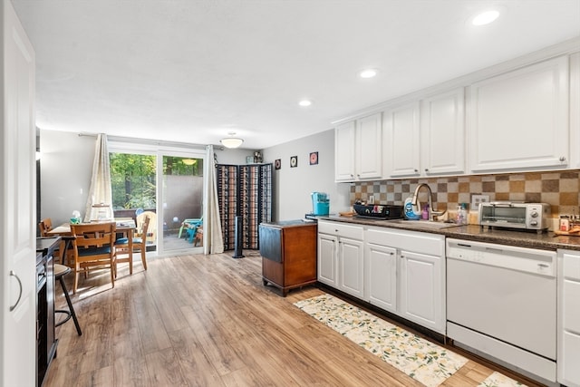 kitchen featuring light hardwood / wood-style flooring, dishwasher, white cabinetry, and sink