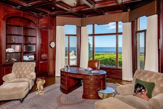 living room with a fireplace and crown molding