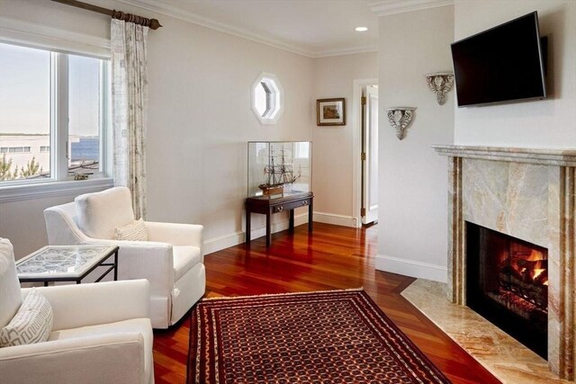 bedroom featuring ornamental molding and dark hardwood / wood-style flooring