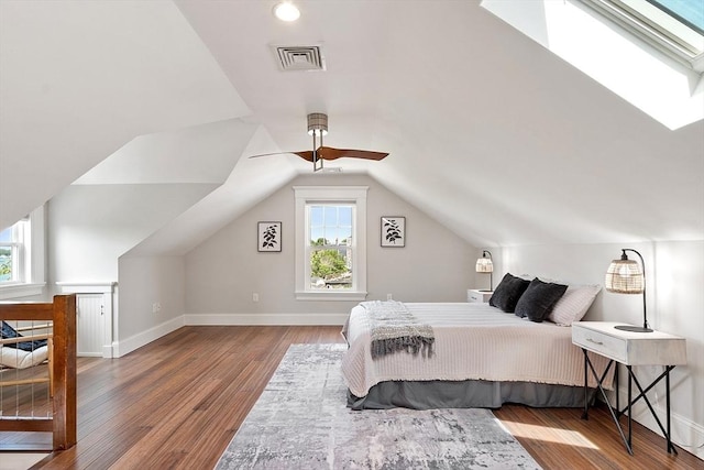 24 Lemon St Unit 2, Salem, MA 01970 - bedroom featuring multiple windows, wood finished floors, a skylight, and lofted ceiling