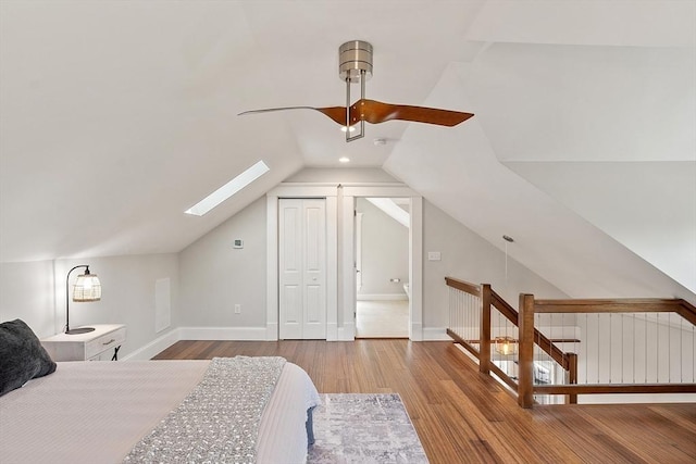 24 Lemon St Unit 2, Salem, MA 01970 - bedroom featuring wood finished floors, a skylight, lofted ceiling, ceiling fan, and a closet