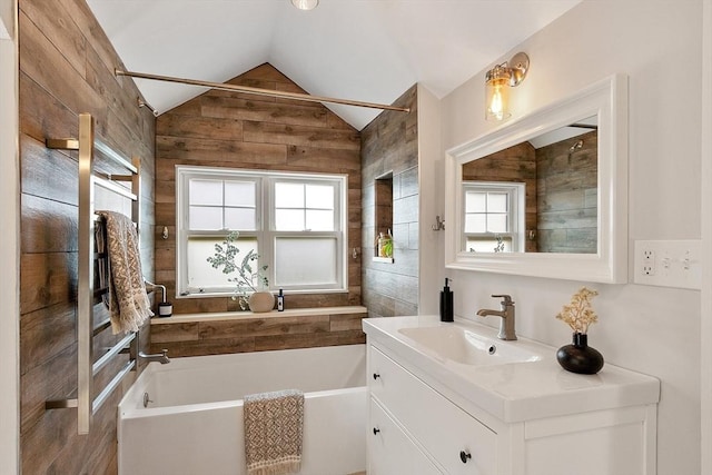 24 Lemon St Unit 2, Salem, MA 01970 - full bathroom featuring a bath, vanity, wood walls, and vaulted ceiling
