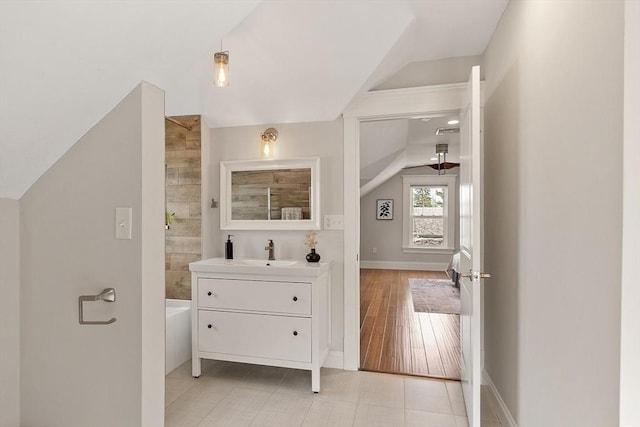 24 Lemon St Unit 2, Salem, MA 01970 - bathroom featuring lofted ceiling, vanity, and tub / shower combination