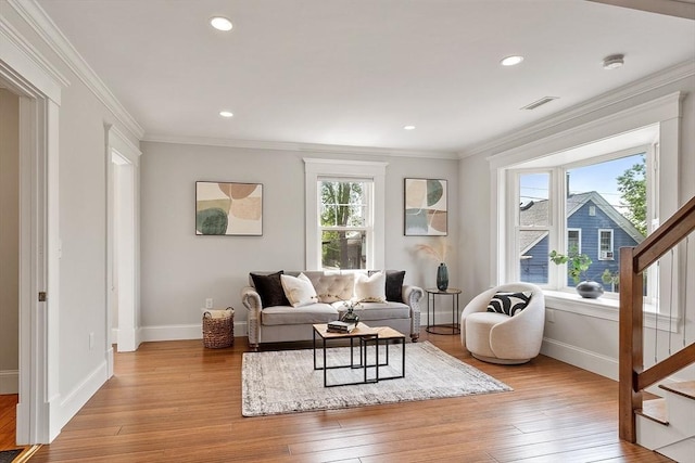 24 Lemon St Unit 2, Salem, MA 01970 - living room with plenty of natural light, stairway, light wood-style flooring, crown molding, and recessed lighting