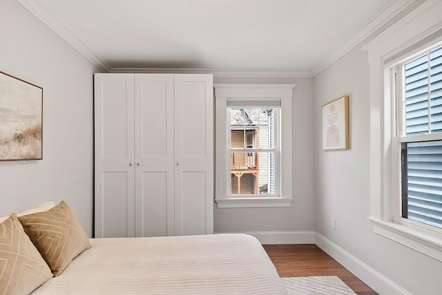 24 Lemon St Unit 2, Salem, MA 01970 - bedroom featuring wood finished floors, crown molding, and a closet
