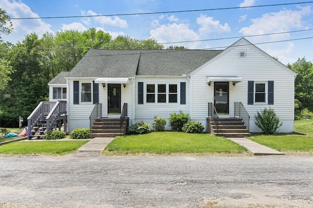 10 Hazel Plz, Uxbridge, MA 01569 - view of front of home featuring roof with shingles and a front lawn