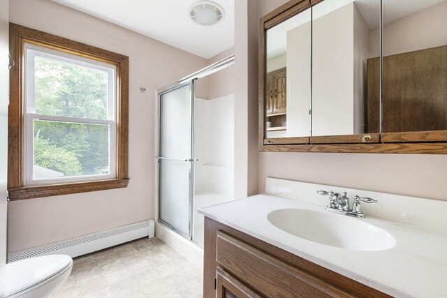 10 Hazel Plz, Uxbridge, MA 01569 - bathroom with a baseboard heating unit, toilet, vanity, and a shower stall