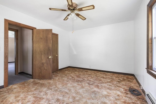 10 Hazel Plz, Uxbridge, MA 01569 - empty room featuring baseboard heating, carpet floors, and a ceiling fan