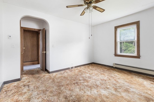 10 Hazel Plz, Uxbridge, MA 01569 - unfurnished room featuring baseboards, baseboard heating, ceiling fan, carpet floors, and arched walkways