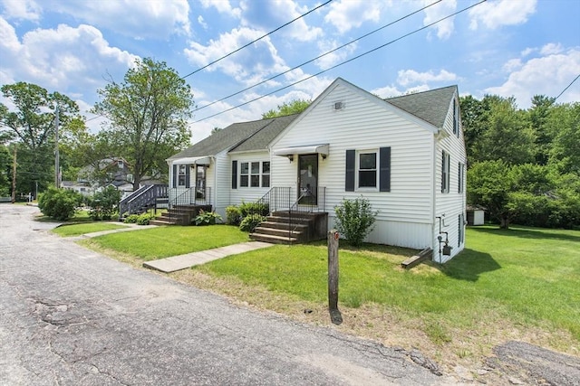 10 Hazel Plz, Uxbridge, MA 01569 - view of front of house featuring a front lawn and roof with shingles