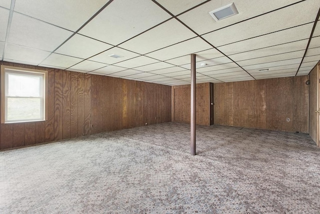 10 Hazel Plz, Uxbridge, MA 01569 - below grade area featuring a drop ceiling, carpet flooring, and wood walls