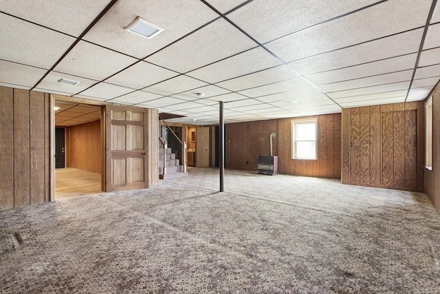 10 Hazel Plz, Uxbridge, MA 01569 - basement featuring stairway, wood walls, carpet flooring, and a paneled ceiling