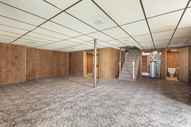 10 Hazel Plz, Uxbridge, MA 01569 - finished below grade area with water heater, stairway, a paneled ceiling, carpet floors, and wooden walls