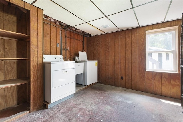 10 Hazel Plz, Uxbridge, MA 01569 - washroom featuring a garage, washing machine and clothes dryer, and wood walls