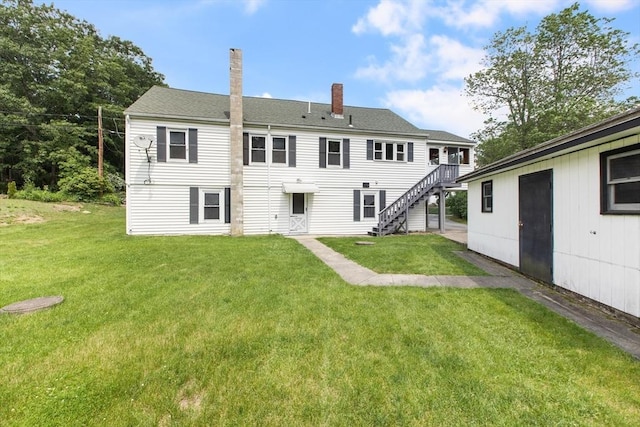 10 Hazel Plz, Uxbridge, MA 01569 - back of property featuring a chimney, stairway, a yard, and a shingled roof