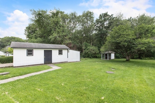 10 Hazel Plz, Uxbridge, MA 01569 - view of grassy yard featuring an outbuilding