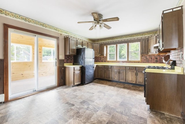 10 Hazel Plz, Uxbridge, MA 01569 - kitchen featuring freestanding refrigerator, ceiling fan, light countertops, and plenty of natural light