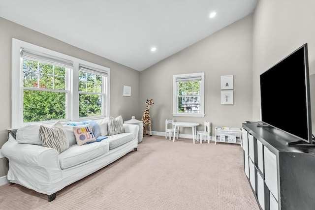 carpeted living area with vaulted ceiling, baseboards, and recessed lighting