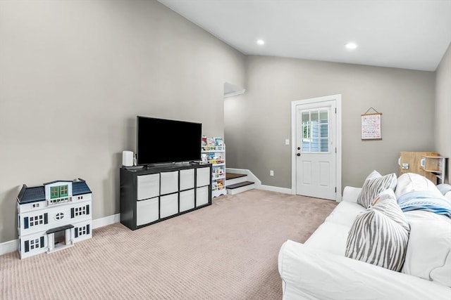 carpeted living area with lofted ceiling, baseboards, and recessed lighting