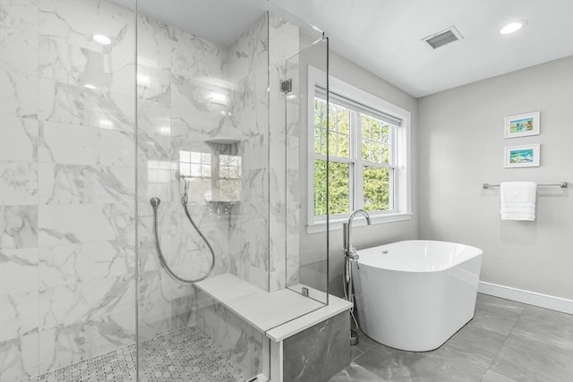 bathroom with a freestanding bath, a marble finish shower, baseboards, marble finish floors, and recessed lighting