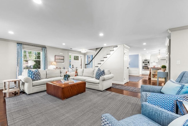 living area featuring ornamental molding, stairs, recessed lighting, dark wood-type flooring, and baseboards