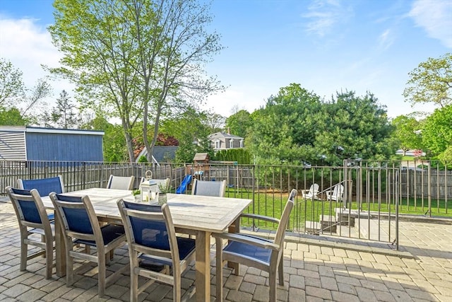 view of patio with fence and outdoor dining space