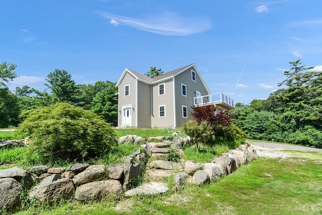 view of home's exterior with a deck