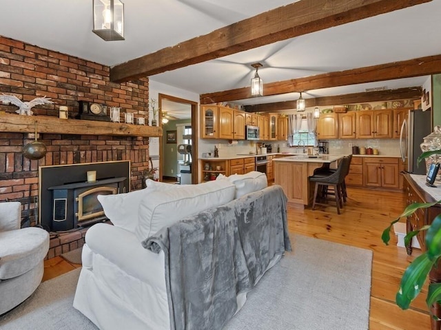 58 Fitzpatrick Rd, Grafton, MA 01519 - living room with light wood-style flooring, ceiling fan, and beam ceiling