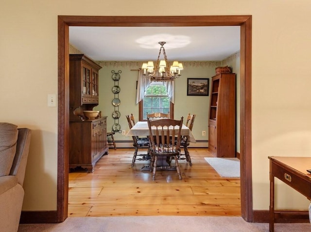 58 Fitzpatrick Rd, Grafton, MA 01519 - dining space featuring a chandelier, light wood-style flooring, a baseboard radiator, and baseboards