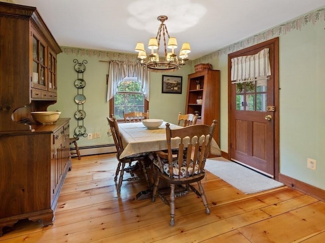 58 Fitzpatrick Rd, Grafton, MA 01519 - dining space with a chandelier, a baseboard radiator, baseboards, and light wood-style flooring