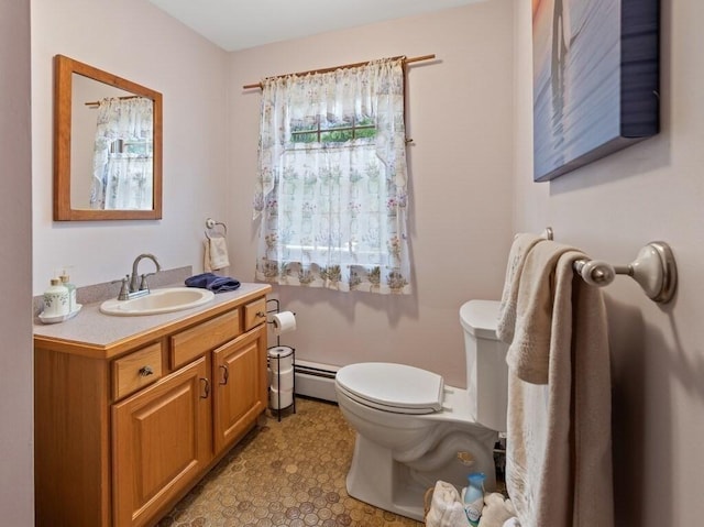 58 Fitzpatrick Rd, Grafton, MA 01519 - bathroom featuring vanity, a baseboard heating unit, and toilet