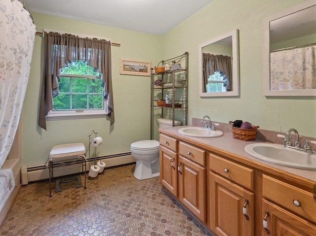 58 Fitzpatrick Rd, Grafton, MA 01519 - bathroom featuring double vanity, toilet, baseboard heating, and curtained shower