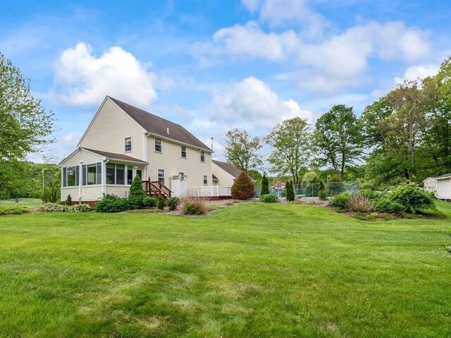 58 Fitzpatrick Rd, Grafton, MA 01519 - rear view of property with a sunroom and a lawn