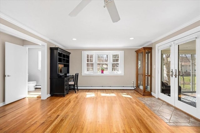 interior space with a baseboard heating unit, french doors, light wood-style flooring, a ceiling fan, and crown molding