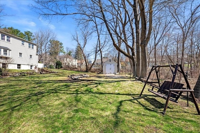view of yard featuring an outbuilding and a storage shed