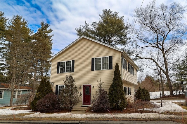 view of front of home featuring fence