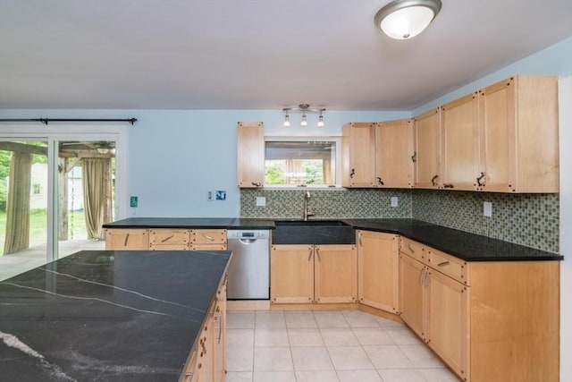 28 River St, Erving, MA 01344 - kitchen featuring stainless steel dishwasher, a sink, light brown cabinetry, and dark countertops