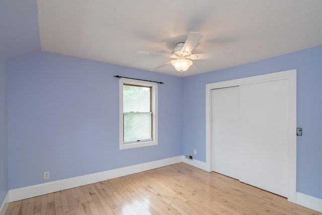 28 River St, Erving, MA 01344 - unfurnished bedroom featuring light wood-style floors, a closet, baseboards, and a ceiling fan