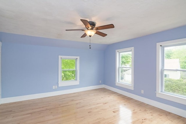 28 River St, Erving, MA 01344 - unfurnished room featuring plenty of natural light, baseboards, light wood finished floors, and ceiling fan